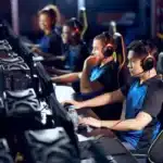 A group of gamers playing Competitive Gaming with co-players.